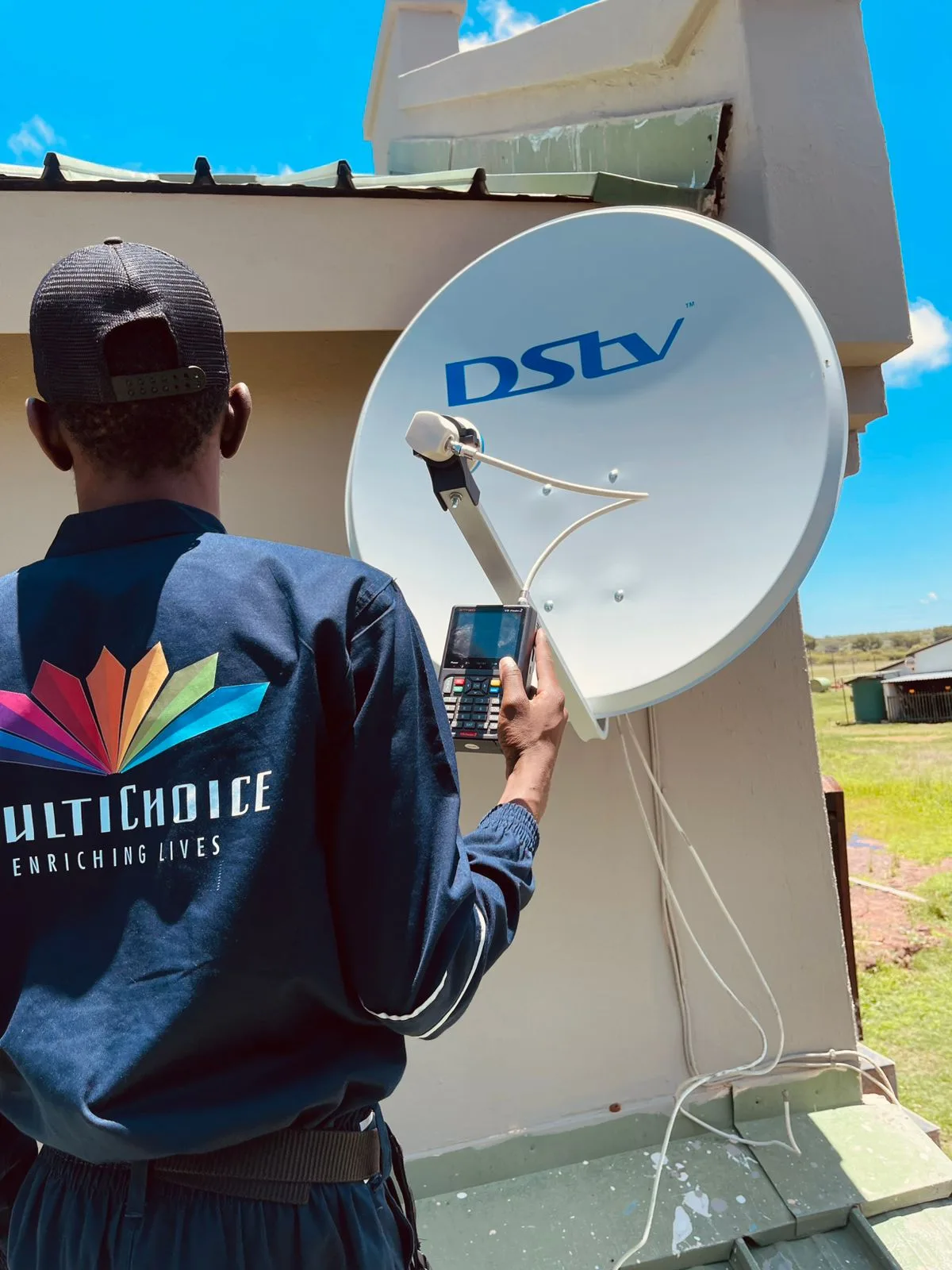 Accredited DSTV technician aligning a satellite dish on a Gauteng roof