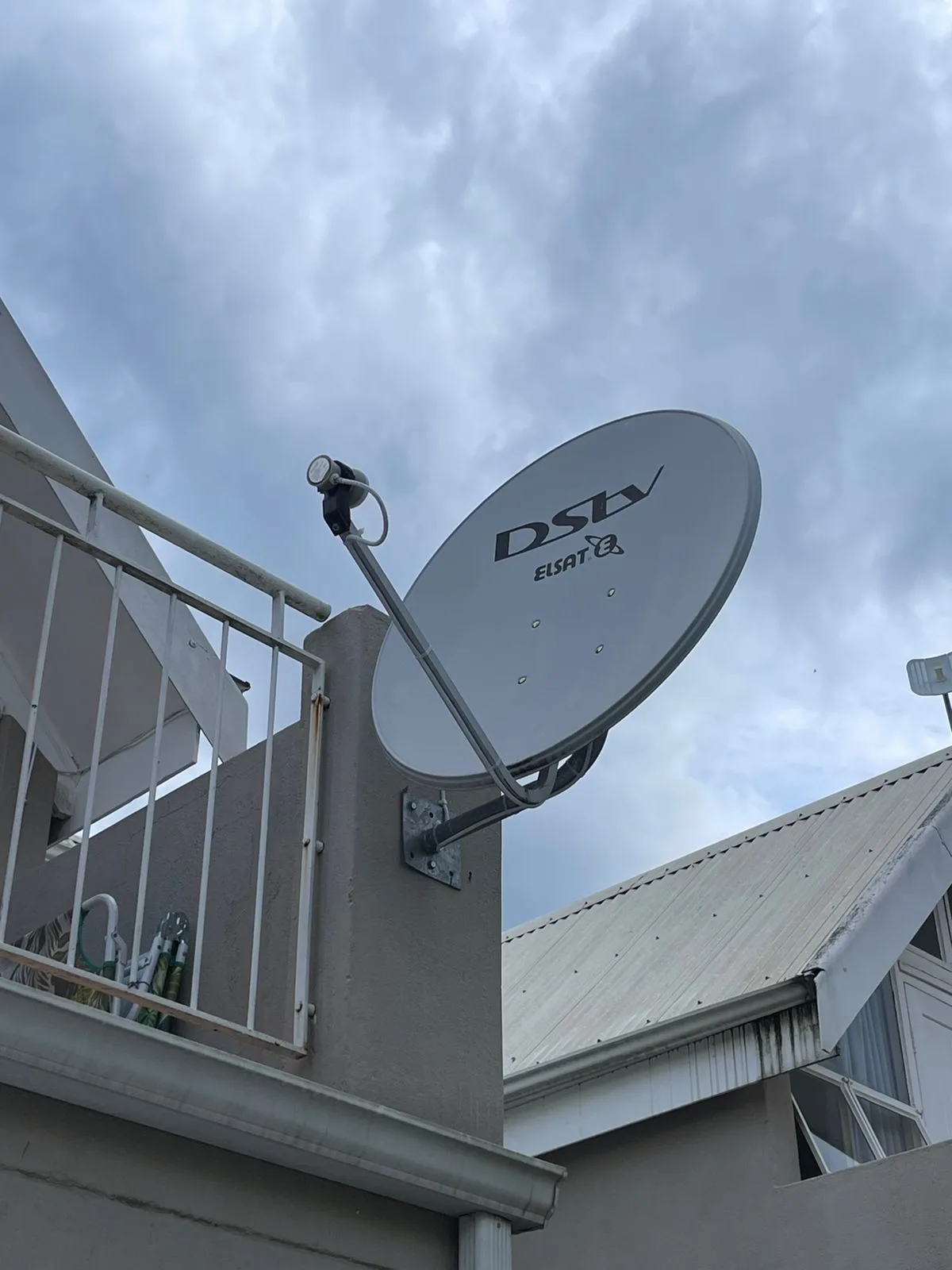 Elsat DSTV-compatible dish mounted on an apartment balcony wall